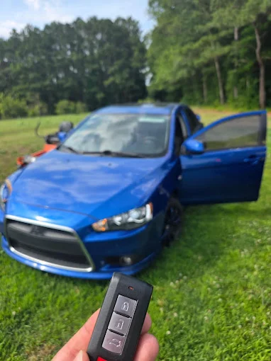 Replacement smart key fob programmed for a blue Mitsubishi Lancer