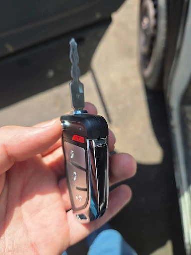 Broken Dodge flip key with a snapped blade needing replacement