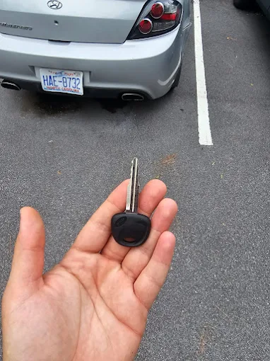 Replacement transponder key cut for a silver Hyundai in a parking lot